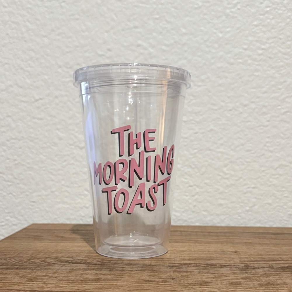 The Morning Toast Clear Tumbler with Pink Text